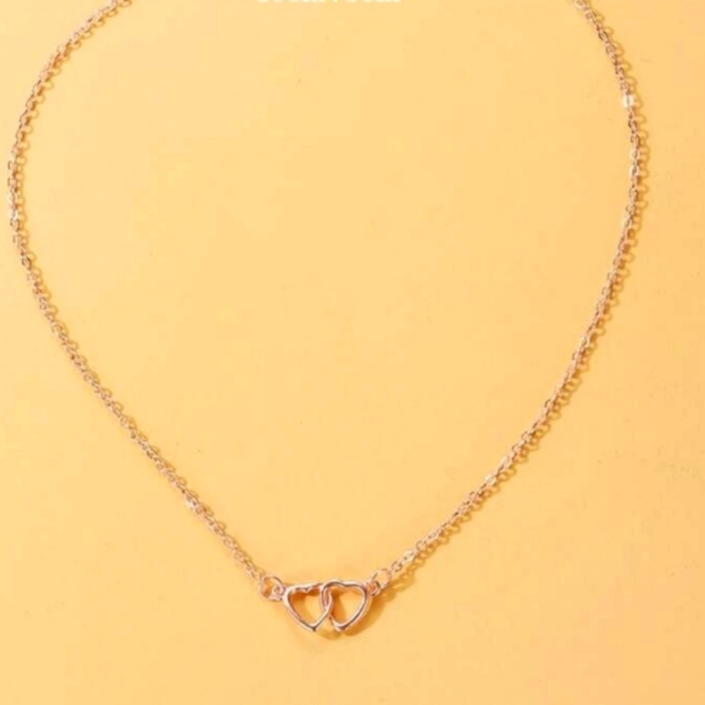 NIP Two hearts entwined rosegold necklace In Faux Gold
